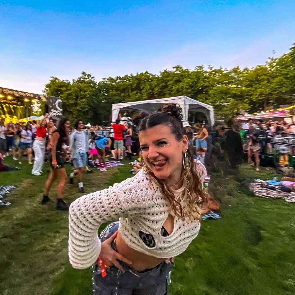 Lilla smiling at an outdoor music festival